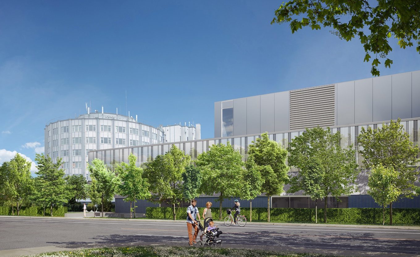 Exterior view of Santa Cabrini Hospital in Montreal, featuring the original building on the left and a new modern glass-fronted wing, surrounded by trees and landscaping